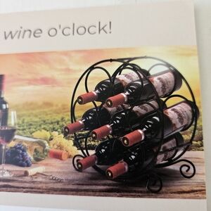 Black Metal Wine Rack with Red Wine Bottles
